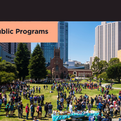 A festival takes place at Yerba Buena Gardens, with various San Francisco buildings seen in the background