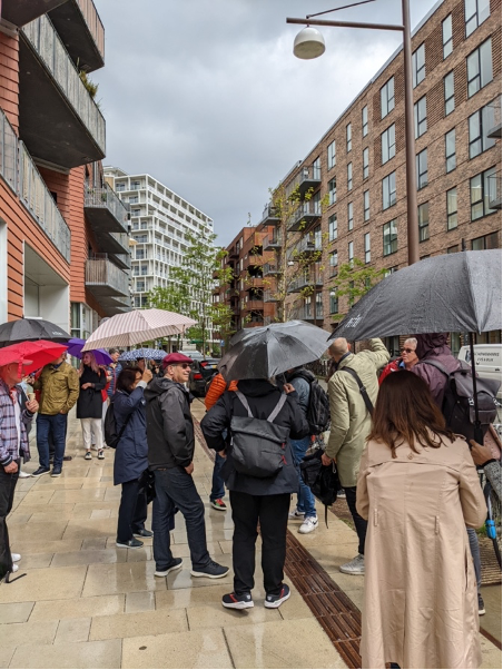 people walking in Copenhagen with umbrellas