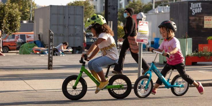 Children riding their bikes in the street