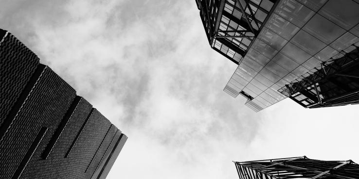 Looking up at a sky framed by skyscrapers