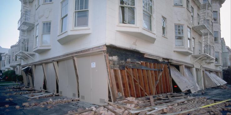 A building in the Marina District at Beach and Divisadero settled onto its buckled garage supports.