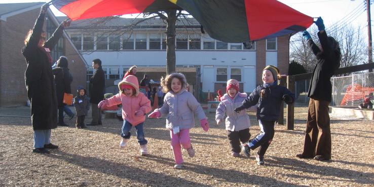 Children running under canopy