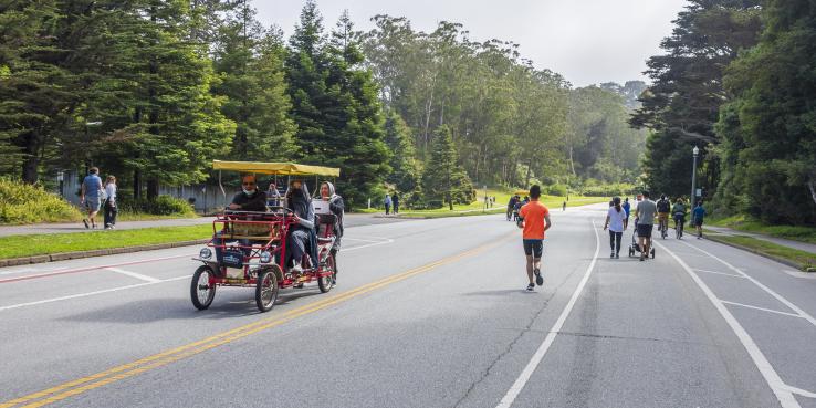 folks riding on JFK drive