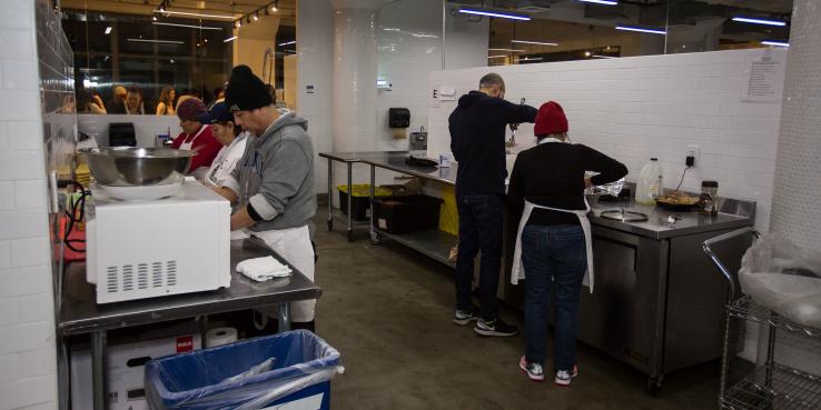 People cooking in a food incubator kitchen