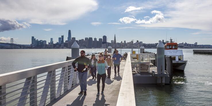 Photo of passengers walking off of the Treasure Island Ferry