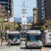 Market Street in San Francisco busy with buses and bikers