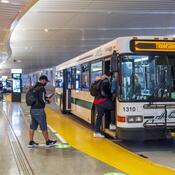 Transit users board the bus at the Salesforce Transit Center.