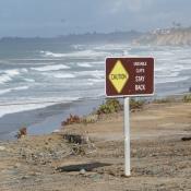 unstable cliffs stay back sign