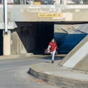 person walking down an u