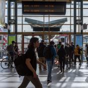 People walking around the SF Caltrain station