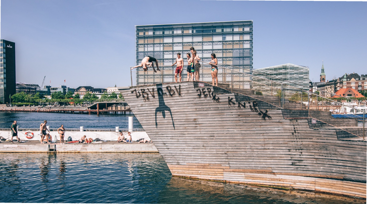 People diving and swimming in Copenhagen harbor