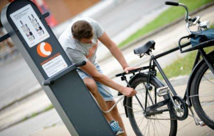 A public bike tire pump along a bicycle superhighway route.