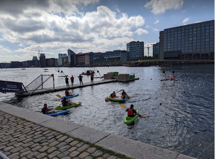 people paddling boats in copenhagen