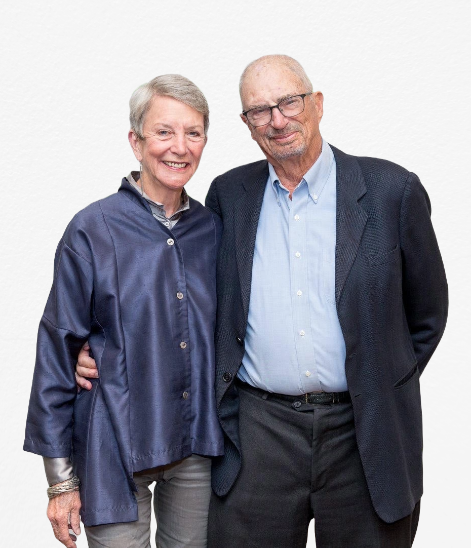 Anne Halsted and Wells Whitney in formal attire standing before a neutral background