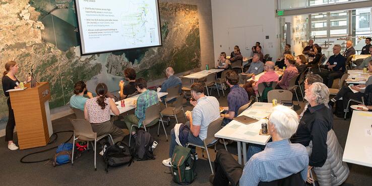 photo of workshop attendees listening to a presentation