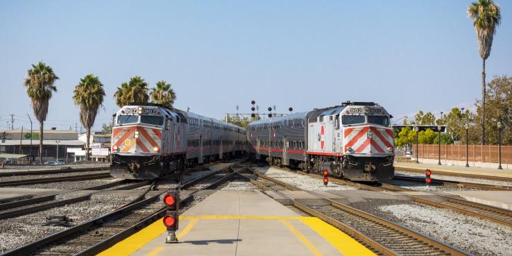 Two Caltrain trains on passing tracks at Diridon Station