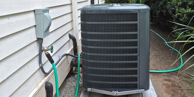 electric heat pump in a backyard