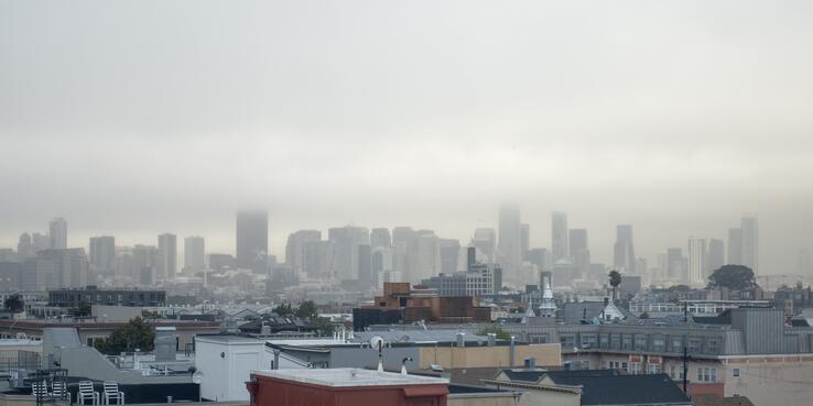 San Francisco skyline with fog and smog obscuring buildings