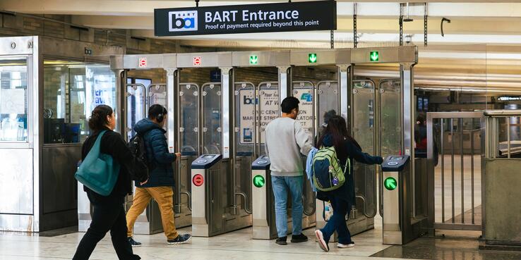 riders entering BART fare gates