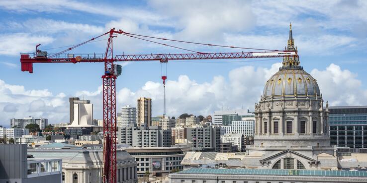Photo of San Francisco City Hal building with a construction crane in the foreground