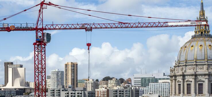 photo of San Francisco City Hall with a construction crane in the foreground