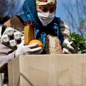 Grandmother holding food package during coronavirus quarantine